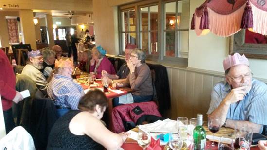 A group of people sitting at tables

Description automatically generated with medium confidence