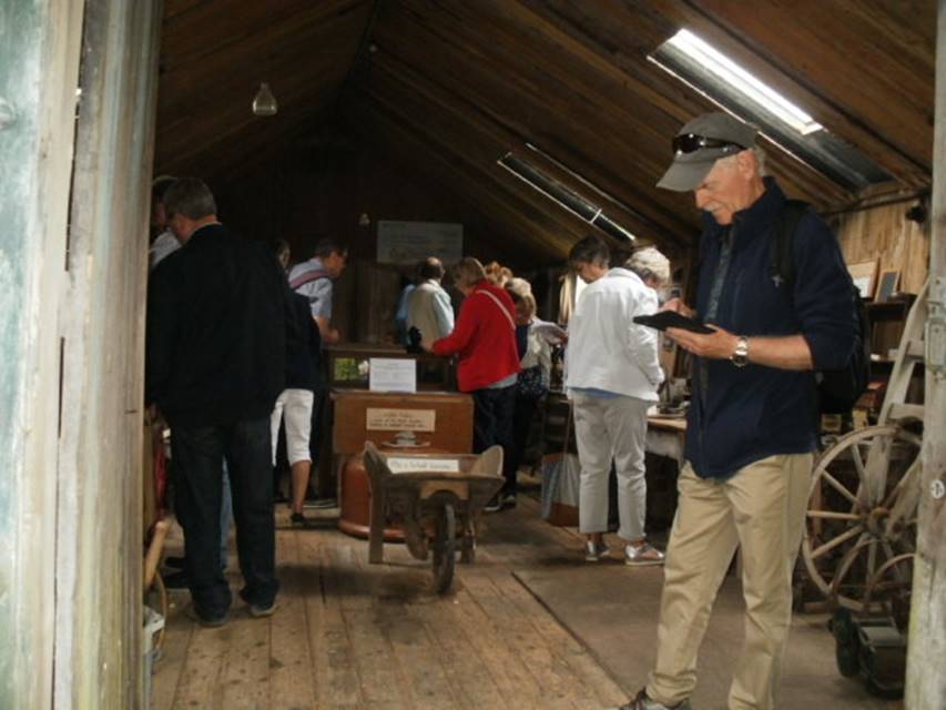 A group of people standing in a room

Description automatically generated