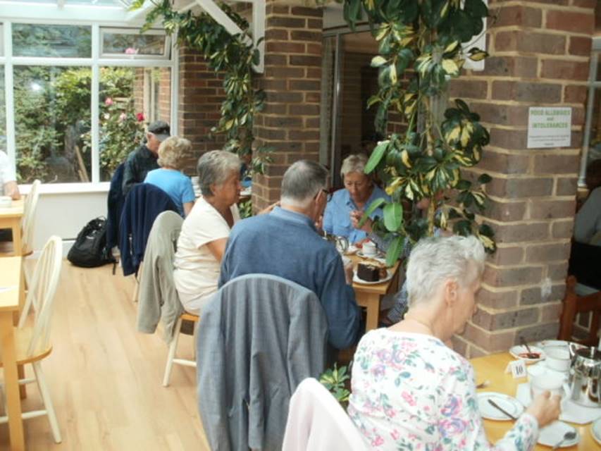 A group of people sitting at a table

Description automatically generated