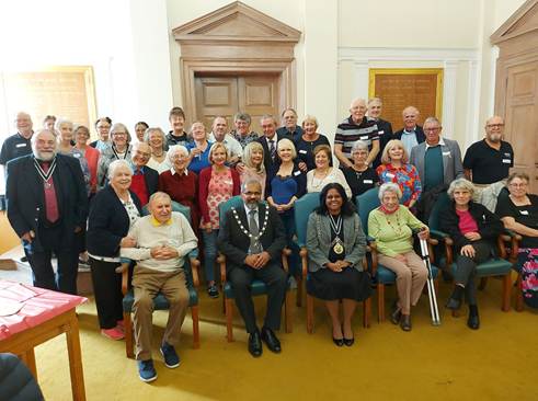 A group of people posing for a photo

Description automatically generated